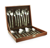 Complete stainless steel cutlery set with decorative handles displayed in an open brown presentation case.